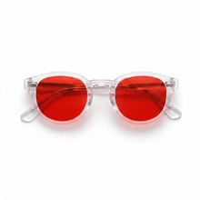 Round sunglasses with translucent clear frames and vibrant red lenses, shown on a plain white background.