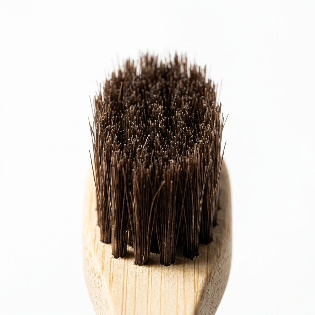 Horsehair Toothbrush — close-up macro shot of the natural horsehair bristle head.