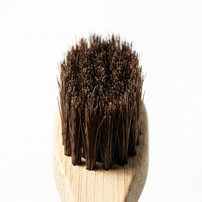 Horsehair Toothbrush — close-up macro shot of the natural horsehair bristle head.