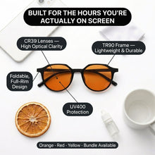 Black foldable sunglasses with orange-tinted lenses displayed on a white background with product feature callouts and lifestyle props including a dried orange slice, a white mug, and a small bottle.