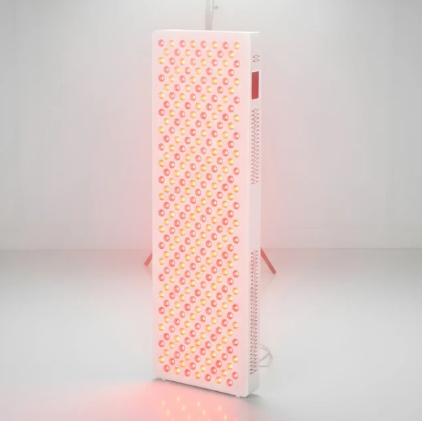 Angled view of a red light therapy panel on a white background