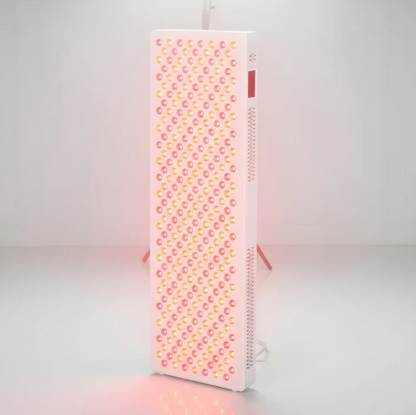 Angled view of a red light therapy panel on a white background
