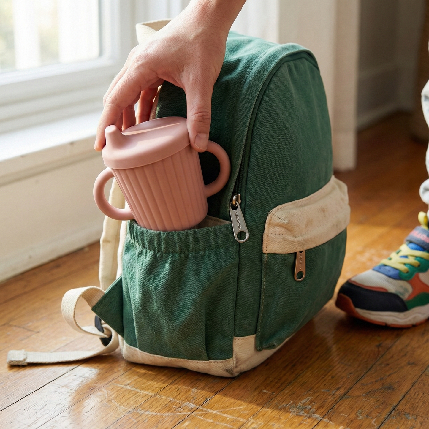 Silicone Sippy Cup — lifestyle photo showing the product in use.